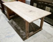 19th century pine trestle-type table, the rectangular plank top on square legs and side