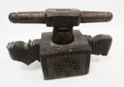 Indian carved wooden press or juicer, comprising crank with twin turned handles rotating around a