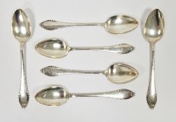 Set of six early 20th century Danish silver dessert spoons by Christian F. Heise, with hammered