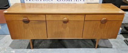 Mid-century Austinsuite teak sideboard comprising three drawers, the central drawer fitted with