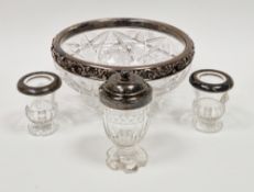 Cut glass fruit bowl with sterling silver rim having an embossed foliate scroll decorated rim,