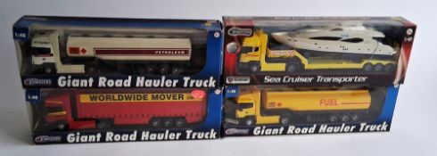 Four boxed Halsall Teamsters boxed diecast models to include Giant Road Hauler Trucks and Sea