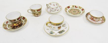 Collection of five Royal Crown Derby bone china miniature teacups and saucers, circa 1890 and later,