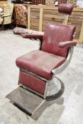 Mid-century Belmont barber's chair upholstered in red leatherette, with adjustable head rest, foot