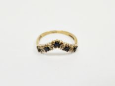 9ct yellow gold and sapphire wishbone ring, with seven illusion set sapphires, size J, approximate