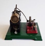 Bing live steam tinplate stationary engine on raised base with maker's mark on boiler