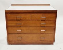 Mid-century Remploy teak military chest, the rectangular top with short back upstand and formica