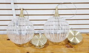 Pair of contemporary ceiling light fitting, each with globular clear glass shades having cut and