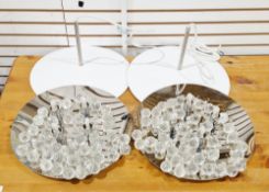 Pair of contemporary flush ceiling light fittings of circular form, having a mirrored surface,