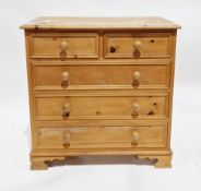Modern pine chest, the rectangular top with two short and three long drawers with raised moulded