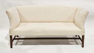 19th century square back settee with curved arms, upholstered in a cream fabric, on mahogany