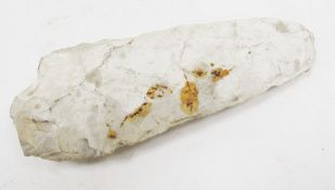 Neolithic chipped stone axe head of pointed ovoid form, 13.5cm long
