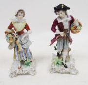 Pair of Sitzendorf late 19th century figures of a gentleman and companion, he modelled standing