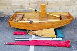 Wooden folding sailboat, possibly by seahopper, with sail, oars and transport bag. Approximately 2.
