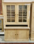 19th century pine cupboard, the upper section with two glazed doors opening to three fixed