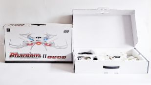 Two Phantom II 4 channel quadcopter drones, each in orignal