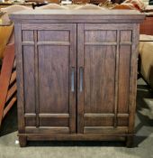 Tresanti Franklin bar cabinet with an oak veneer finish, the two panel doors opening to an