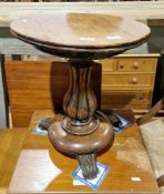 Victorian rosewood lamp table, the circular top on a turned baluster fluted column and circular
