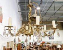 Mid-20th century gilt brass six-branch electrolier in the rococo manner, with prismatic glass