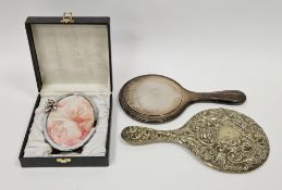 Cased silver oval photograph frame with applied flower to edge of frame having an easel back, 15cm