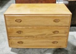 Ercol Windsor Range pale elm chest of three long drawers, each drawer with part recessed oval