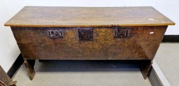 17th century oak six-plank coffer, the hinged lid opening to an interior candle box, iron