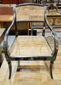 Elbow chair in the Regency manner, with chinoiserie decoration on a black ground, bergere cane