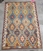 Chobi kilim, 20th century, woven in a bold palette with interlocking lozenges and geometric ornament