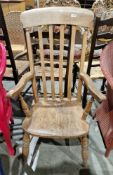 19th century elm and beech lathback windsor elbow chair on turned baluster ringed supports united by