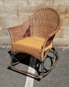 Wicker and bamboo rocking chair with a hooped back, the wicker constructed of different