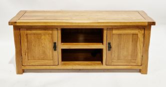 Contemporary Oak Furnitureland low side cabinet/media unit comprising two central shelves flanked