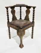 Victorian oak corner tub chair, the top rail with foliate carving, foliate carved shaped solid
