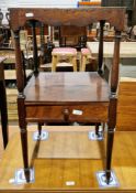 George III mahogany washstand of square form, the top with a wavy carved apron over a shelf with