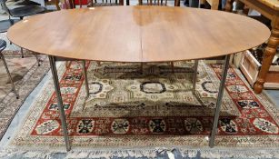 John and Sylvia Reid for Stag mid-century teak oval dining table, with additional slide-out leaf, on