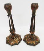 Pair of 19th century Indian Kashmiri wooden candlesticks, hand painted with flowers on a black
