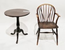 18th century oak table, the circular top on a turned baluster pedestal support with three splayed