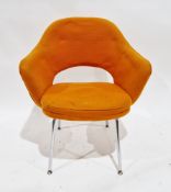 Mid-century Eero Saarinen for Knoll a conference chair upholstered in an orange fabric, on steel