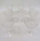 Eight Waterford cut glass tapering conical wine glasses, notch cut and cut with diamonds, etched