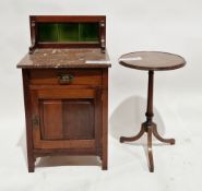 Early 20th century mahogany washstand, having a green tiled splashback and marble top, over a single