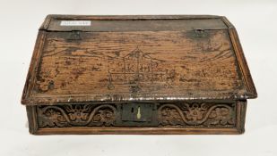 17th century oak bible box, having a raised moulded edge, the iron hinged sloping lid carved with