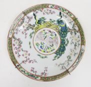 Japanese porcelain charger, 20th century, enamelled with a crane within a roundel, within a border