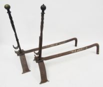 Pair of brass and iron firedogs having brass finial to twisted upright, on arched support, 51cm high