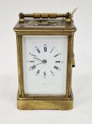 Early 20th century gilt-brass cased striking carriage clock, having bevelled glass panels to four
