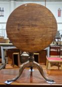 George III mahogany supper table, the circular tilt-top on a turned tapered pedestal, with a twisted