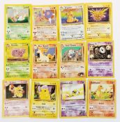 Assorted toys; Pokémon cards from various early sets including fossil holographic Dragonite, neo