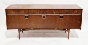 Mid-century Elliots of Newbury teak sideboard, having three frieze drawers over three cupboard