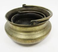 LOT WITHDRAWN Two 19th/early 20th century Asian brass holy water buckets/stoups, each with swing