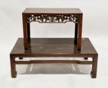 Two Chinese hardwood coffee tables, both of rectangular form, the first with a foliate and symbol