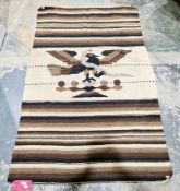 Mexican wool pictorial rug featuring a seated figure wearing a headdress, 151cm x 73cm, Mexican