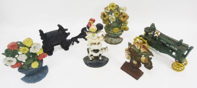 Cast iron doorstop in the form of a horse and stagecoach, 29cm long together with a cast iron